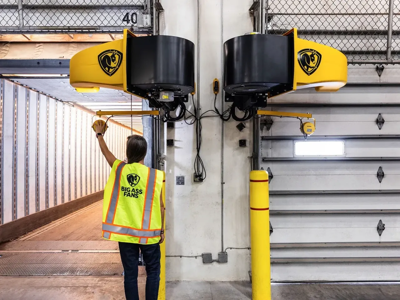 Big Ass Fans dock units mounted beside loading dock doors