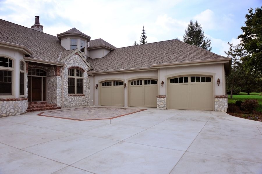 If your garage feels freezing in the winter, overheated in the summer, or you notice the temperature changing the second the door closes, the door itself is usually the reason.